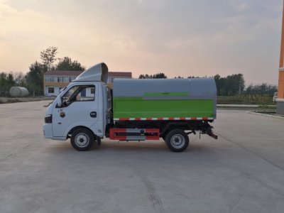 Self dumping garbage truck